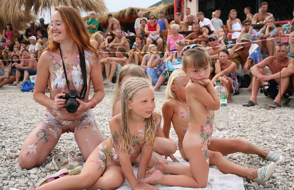 Warm Sand Relaxation photos - A defining feature of naturism is the absence of clothing