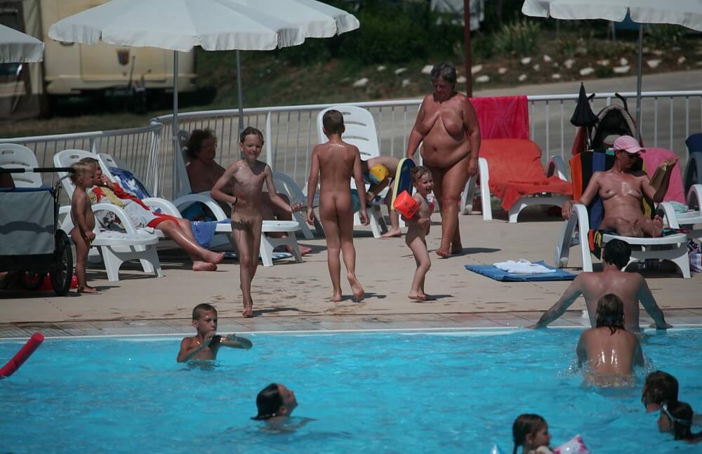 Naturist Afternoon Pool Games pics - Where nudism is commonplace